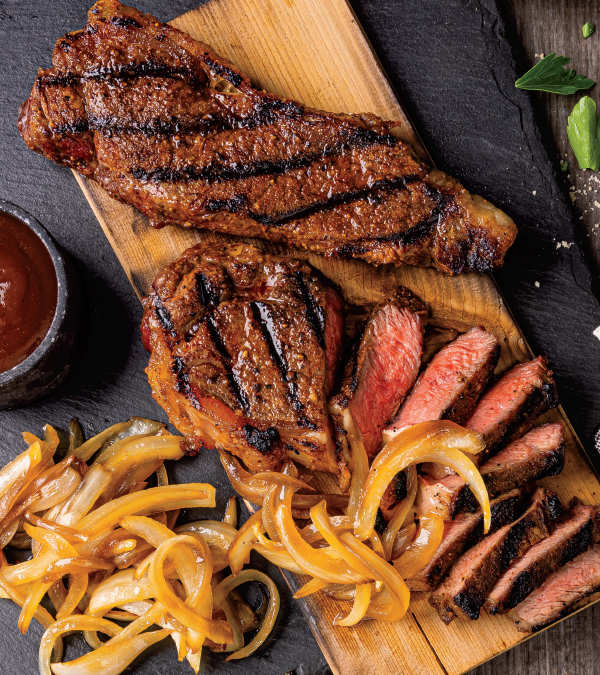 Cedar Plank BBQ Strip Steak with Bourbon Onions
