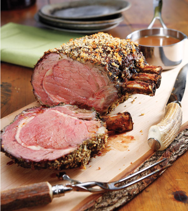 Sliced Roasted Prime Rib With Knife On Plank Stock Photo