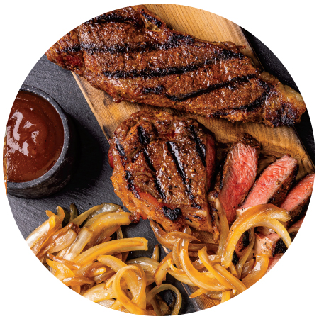Cedar Plank BBQ Strip Steak with Bourbon Onions